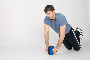 Image showing Athletes preparing juice with wheels