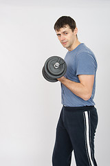 Image showing Portrait of an athlete with a dumbbell in your left hand