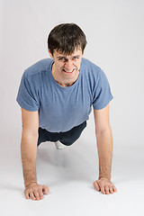 Image showing Tired sportsman wrung from the floor