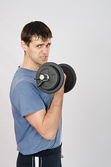 Image showing Tired athlete with dumbbells