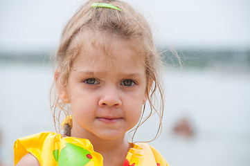 Image showing Portrait of a three-year girl on the beach