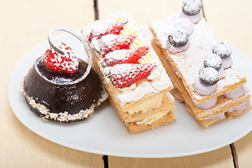 Image showing selection of fresh cream cake dessert plate 