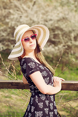 Image showing Cheerful fashionable woman in stylish hat, frock and sunglasses