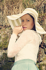 Image showing Cheerful fashionable woman in stylish hat and frock posing