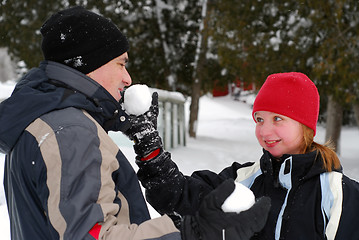 Image showing Family with snowballs