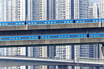 Image showing high speed train on bridge in hong kong downtown city