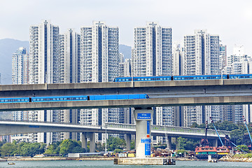 Image showing high speed train on bridge in hong kong downtown city