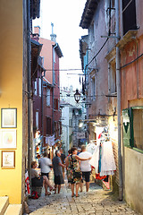 Image showing Tourists walking next to souvenir shops in Rovinj