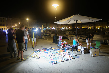 Image showing Souvenir pictures on floor in Rovinj