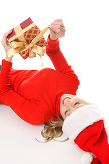 Image showing Female unties a Christmas present