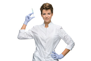 Image showing Portrait of lady surgeon showing syringe 