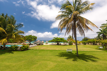 Image showing tropical garden and  the ocean beach