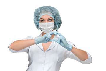 Image showing Portrait of lady surgeon showing syringe over white background