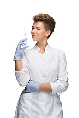 Image showing Portrait of lady surgeon showing syringe 