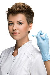 Image showing pretty young woman and vaccine syringe