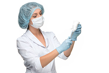Image showing Portrait of lady surgeon holding surgical instrument over white background