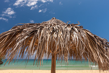 Image showing straw umbrella on a tropical beach