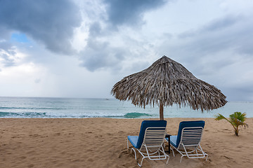 Image showing Sunbed and umbrella on a tropical beach