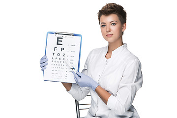 Image showing young woman ophthalmologist with eye chart