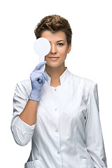 Image showing Optometry concept - pretty young woman closes eye