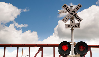 Image showing Train Passing Railroad Crossing Warning Lights Flashing