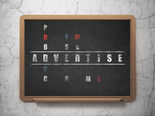 Image showing Marketing concept: word Advertise in solving Crossword Puzzle