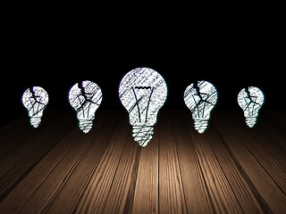 Image showing Finance concept: light bulb icon in grunge dark room