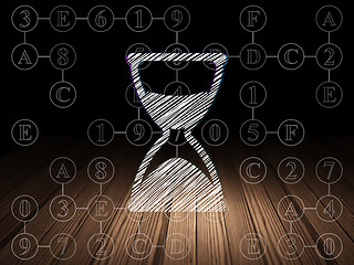 Image showing Time concept: Hourglass in grunge dark room