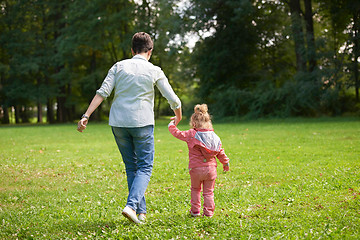 Image showing happy family playing together outdoor in park