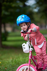 Image showing little girl with bicycle