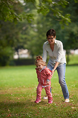 Image showing happy family playing together outdoor in park