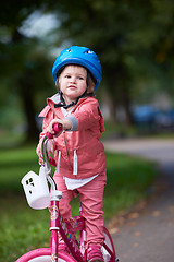 Image showing little girl with bicycle