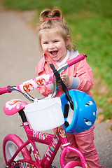 Image showing little girl with bicycle