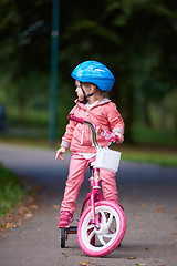 Image showing little girl with bicycle