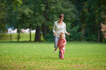 Image showing happy family playing together outdoor in park