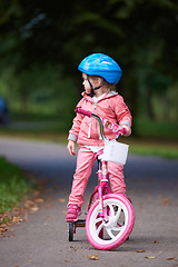 Image showing little girl with bicycle