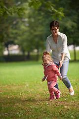 Image showing happy family playing together outdoor in park