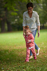 Image showing happy family playing together outdoor in park