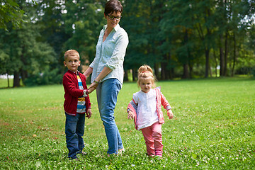 Image showing happy family playing together outdoor in park