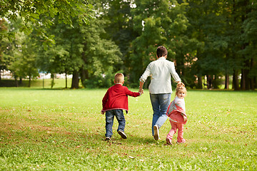 Image showing happy family playing together outdoor in park