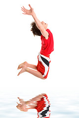 Image showing Leaping child hands stretched to sky