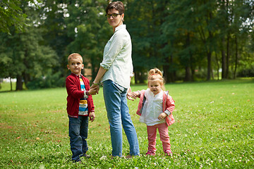 Image showing happy family playing together outdoor in park