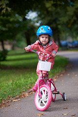 Image showing little girl with bicycle
