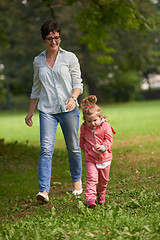 Image showing happy family playing together outdoor in park