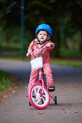 Image showing little girl with bicycle