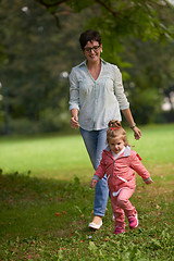 Image showing happy family playing together outdoor in park