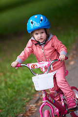 Image showing little girl with bicycle