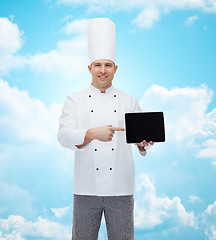 Image showing happy male chef cook showing tablet pc