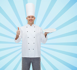 Image showing happy male chef cook showing thumbs up and plate