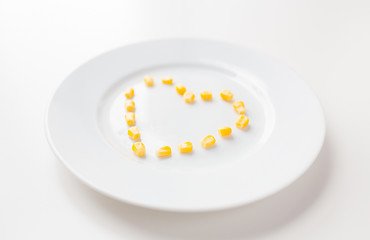 Image showing close up of plate with corn in heart shape 